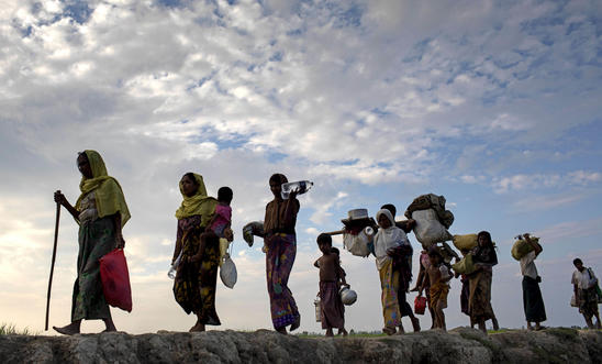 Rohingya refugees walk through a paddy field in Bangladesh in November 2017, after fleeing genocide in Myanmar’s Rakhine state Rohingya refugees walk through a paddy field in Bangladesh in November 2017, after fleeing genocide in Myanmar’s Rakhine state